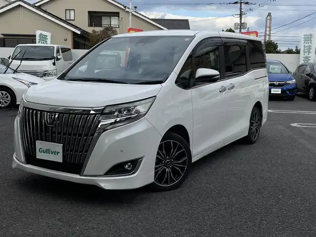 トヨタ エスクァイア Gi 大分県 2018(平30)年 7.8万km ホワイトパールクリスタルシャイン 〇ワンオーナー/〇純正メモリーナビ（NSZT-Y66T）/　CD/DVD/BT/ラジオ/フルセグ/〇純正フリップダウンモニター/〇社外17インチアルミホイール/〇バックカメラ/〇ETC/〇クルーズコントロール/〇ステアリングスイッチ/〇前後ドライブレコーダー/〇ウッドステアリング/〇アイドリングストップ/〇両側パワースライドドア/〇プリクラッシュセーフティシステム/〇レーンキープアシスト/〇オートハイビームアシスト/〇ウインカーミラー/〇クリアランスソナー/〇シートヒーター/〇フロアマット/〇ドアバイザー/〇プライバシーガラス/〇保証書/〇スペアキー