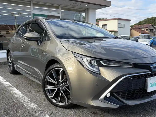 トヨタ カローラ スポーツ ハイブリッドG Z 三重県 2019(平31)年 5万km オキサイドブロンズM ワンオーナー /登録時走行距離４９７６０km/♪トヨタセーフティセンス/　・プリクラッシュセーフティ(PCS)/　・レーントレーシングアシスト(LTA)/　・ロードサインアシスト(RSA)/　・レーダークルーズコントロール(全車速追従機能付き)/　・ブラインドスポットモニター(BSM)/　・クリアランスソナー/　・パーキングサポートブレーキ(PKSB)/　・ドライブモードセレクトスイッチ/♪純正ナビ/　・Bluetooth・DTV・CD再生・AUX/♪バックガイドカメラ/♪スマートキーx２/♪プッシュスタート/♪LEDヘッドライト/♪LEDフォグライト/♪オートマチックハイビーム/♪オートライト/♪ドライブレコーダー/♪革巻きステアリング/♪ステアリングスイッチ/♪オートリトラクタブルミラー/♪ウィンカーミラー/♪電子パーキングブレーキ/♪オートブレーキホールド/♪充電用USBポート/♪ビルトインETC/♪ドアバイザー/♪プライバシーガラス/♪ライトレベリング/♪横滑り防止機能/♪サイド/カーテン/ニーエアバック