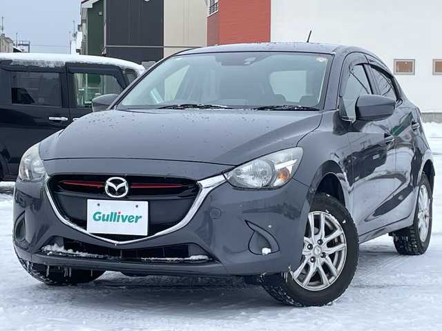 マツダ デミオ XD 道央・札幌 2015(平27)年 9.6万km メテオグレーマイカ 4WD/ワンオーナー/純正メモリーナビ/AM/FM/BT/SD/CD/DVD/フルセグ/衝突被害軽減ブレーキ/横滑り防止装置/バックカメラ/アイドリングストップ/ステアリングリモコン/MTモード付AT/プッシュスタート/スマートキー/ハロゲンヘッドライト/ヘッドライトレベライザー/電動格納ミラー/社外フロアマット/ドアバイザー