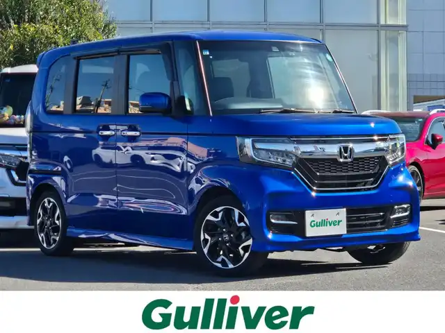 ホンダ Ｎ ＢＯＸ カスタム G L ターボ ホンダセンシング 鹿児島県 2019(令1)年 2.6万km ブリリアントスポーティブルーメタリック2トーン ターボ車　/レーダークルーズコントロール　/ビルトインＥＴＣ２．０　/ドライブレコーダー　/純正ＳＤナビ（ＶＸＭ－２０４ＶＦｉ）　/Ｂｌｕｅｔｏｏｔｈオーディオ　/フルセグテレビ　/バックカメラ　/D+N席シートヒーター/両側パワースライドドア/純正アルミホイール(15インチ)/横滑り防止機能/レーンキープアシスト/LEDヘッドライト/プッシュスタート/スマートキー