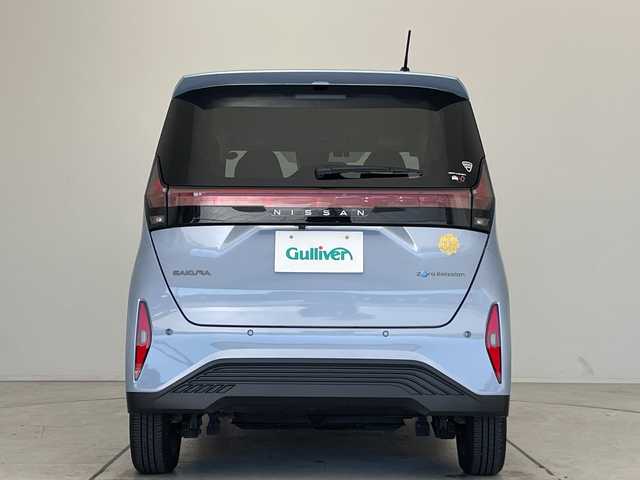 日産 サクラ X 90周年記念車 愛知県 2024(令6)年 0.7万km ライトブルー 純正9型ディスプレイオーディオ　ナビ機能なし/全方位カメラ/バックカメラ/コーナーセンサー/純正アルミホイール/LEDヘッドライト/オートマチックハイビーム/ドライブレコーダー/ETC/ワイヤレス充電機/衝突軽減システム/Bluetooth/ステアリングスイッチ/スマートキー/プッシュスタート