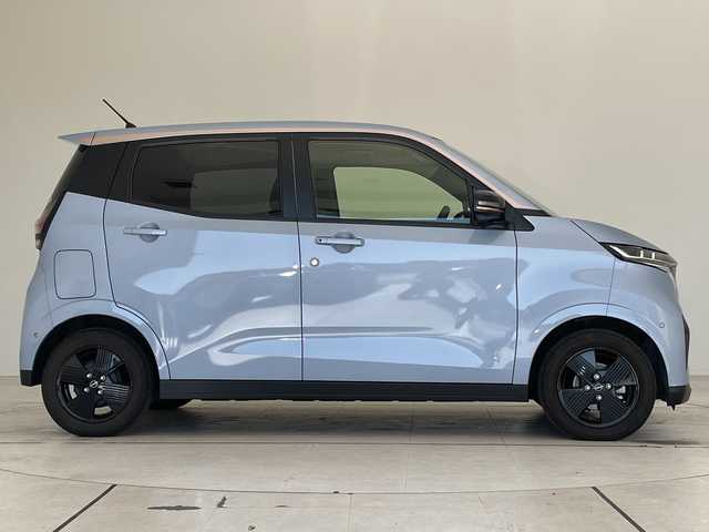 日産 サクラ X 90周年記念車 愛知県 2024(令6)年 0.7万km ライトブルー 純正9型ディスプレイオーディオ　ナビ機能なし/全方位カメラ/バックカメラ/コーナーセンサー/純正アルミホイール/LEDヘッドライト/オートマチックハイビーム/ドライブレコーダー/ETC/ワイヤレス充電機/衝突軽減システム/Bluetooth/ステアリングスイッチ/スマートキー/プッシュスタート