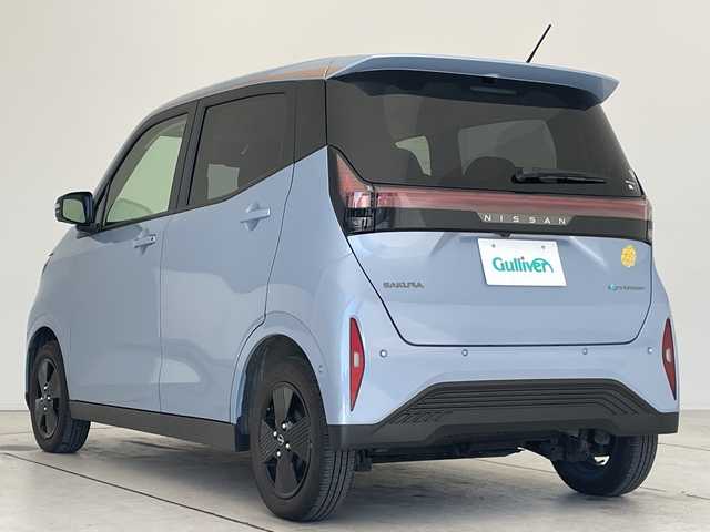 日産 サクラ X 90周年記念車 愛知県 2024(令6)年 0.7万km ライトブルー 純正9型ディスプレイオーディオ　ナビ機能なし/全方位カメラ/バックカメラ/コーナーセンサー/純正アルミホイール/LEDヘッドライト/オートマチックハイビーム/ドライブレコーダー/ETC/ワイヤレス充電機/衝突軽減システム/Bluetooth/ステアリングスイッチ/スマートキー/プッシュスタート