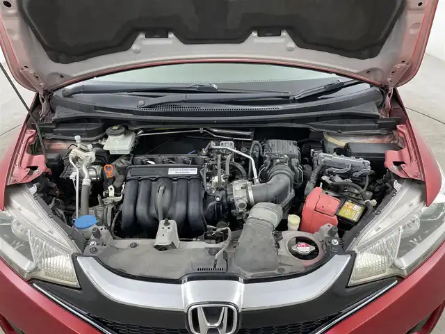 ホンダ フィット ハイブリット Fパッケージ コンフォートED 大分県 2016(平28)年 7.2万km プレミアムクリスタルレッドM ワンオーナー/純正SDナビ（VXM-175VFi）/ BT/CD/DVD/フルセグ/バックカメラ/シートヒーター（前席）/クルーズコントロール/オートライト/アイドリングストップ/ステアリングスイッチ/電動格納ミラー/ビルトインETC/プッシュスタート/スマートキー/純正フロアマット