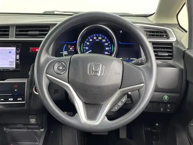 ホンダ フィット ハイブリット Fパッケージ コンフォートED 大分県 2016(平28)年 7.2万km プレミアムクリスタルレッドM ワンオーナー/純正SDナビ（VXM-175VFi）/ BT/CD/DVD/フルセグ/バックカメラ/シートヒーター（前席）/クルーズコントロール/オートライト/アイドリングストップ/ステアリングスイッチ/電動格納ミラー/ビルトインETC/プッシュスタート/スマートキー/純正フロアマット