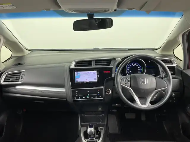 ホンダ フィット ハイブリット Fパッケージ コンフォートED 大分県 2016(平28)年 7.2万km プレミアムクリスタルレッドM ワンオーナー/純正SDナビ（VXM-175VFi）/ BT/CD/DVD/フルセグ/バックカメラ/シートヒーター（前席）/クルーズコントロール/オートライト/アイドリングストップ/ステアリングスイッチ/電動格納ミラー/ビルトインETC/プッシュスタート/スマートキー/純正フロアマット