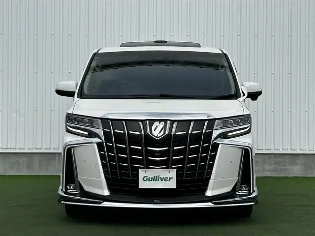 トヨタ アルファード S Cパッケージ 香川県 2019(令1)年 5.1万km ホワイトパールクリスタルシャイン 登録時走行距離：50982km/アルパイン11型ナビ/　CD DVD BT フルセグTV/バックカメラ　左サイドカメラ/アルパインフリップダウンモニター/Wサンルーフ/モデリスタエアロ（フロント　サイド　リアアンダー）/両側パワースライドドア/パワーバックドア/プリクラッシュセーフティシステム/レーンキープアシスト/レーダークルーズコントロール/ブラインドスポットモニター/クリアランスソナー/オートハイビーム/LEDヘッドライト/オートライト/フォグランプ/デジタルインナーミラー/前後ドライブレコーダー/ビルトインETC/レザーシート/シートベンチレーション/パワーシート/シートメモリ/オットマン/ステアリングヒーター/プッシュスタート/スマートキー/スペアキー