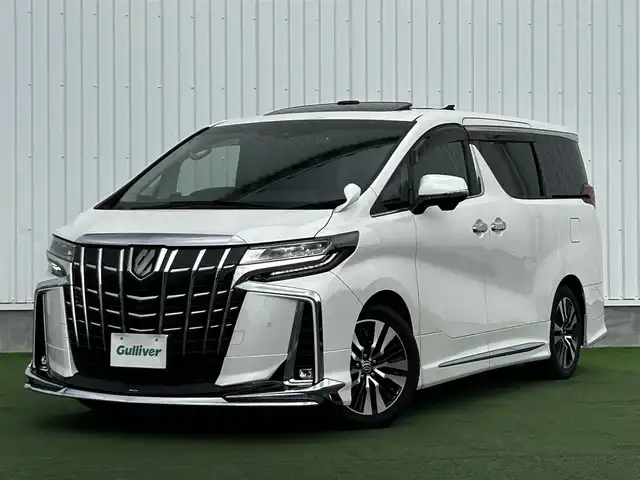 トヨタ アルファード S Cパッケージ 香川県 2019(令1)年 5.1万km ホワイトパールクリスタルシャイン 登録時走行距離：50982km/アルパイン11型ナビ/　CD DVD BT フルセグTV/バックカメラ　左サイドカメラ/アルパインフリップダウンモニター/Wサンルーフ/モデリスタエアロ（フロント　サイド　リアアンダー）/両側パワースライドドア/パワーバックドア/プリクラッシュセーフティシステム/レーンキープアシスト/レーダークルーズコントロール/ブラインドスポットモニター/クリアランスソナー/オートハイビーム/LEDヘッドライト/オートライト/フォグランプ/デジタルインナーミラー/前後ドライブレコーダー/ビルトインETC/レザーシート/シートベンチレーション/パワーシート/シートメモリ/オットマン/ステアリングヒーター/プッシュスタート/スマートキー/スペアキー
