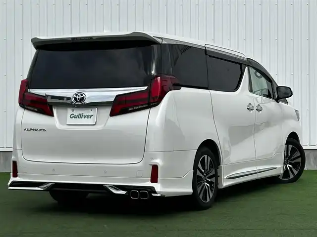 トヨタ アルファード S Cパッケージ 香川県 2019(令1)年 5.1万km ホワイトパールクリスタルシャイン 登録時走行距離：50982km/アルパイン11型ナビ/　CD DVD BT フルセグTV/バックカメラ　左サイドカメラ/アルパインフリップダウンモニター/Wサンルーフ/モデリスタエアロ（フロント　サイド　リアアンダー）/両側パワースライドドア/パワーバックドア/プリクラッシュセーフティシステム/レーンキープアシスト/レーダークルーズコントロール/ブラインドスポットモニター/クリアランスソナー/オートハイビーム/LEDヘッドライト/オートライト/フォグランプ/デジタルインナーミラー/前後ドライブレコーダー/ビルトインETC/レザーシート/シートベンチレーション/パワーシート/シートメモリ/オットマン/ステアリングヒーター/プッシュスタート/スマートキー/スペアキー