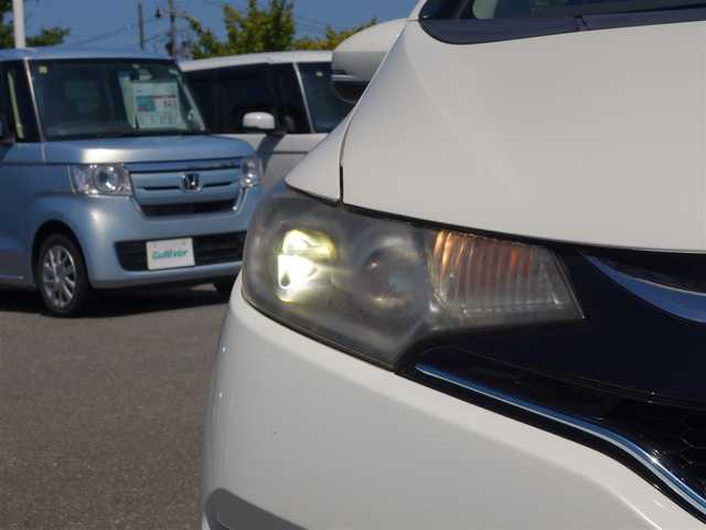 ホンダ フィット ハイブリット Lパッケージ 山形県 2015(平27)年 8.3万km プレミアムホワイトパールⅡ シティブレーキアクティブシステム/純正メモリナビ/　　【CD BT ワンセグ】/バックカメラ/クルーズコントロール/LEDオートヘッドライト/ハーフレザーシート/15インチアルミホイール/アイドリングストップ/ステアリングスイッチ/電動格納ウィンカーミラー/純正フロアマット/ドアバイザ―/スマートキー/ETC