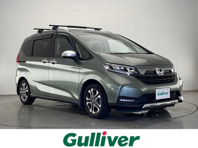 ホンダ フリード ハイブリット クロスター ホンダセンシング 宮崎県 2020(令2)年 7.8万km シルバーミストグリーンM ワンオーナー/寒冷地仕様/Honda SENSING/〇衝突軽減ブレーキ（CMBS）/〇誤発進抑制機能/〇路外逸脱警報機能/〇車線維持支援システム（LKAS）/〇アダプティブクルーズコントロール(ACC)/〇標識認識機能/〇先行車発進お知らせ機能/純正7インチSDナビ/フルセグTV/CD/DVD/Bluetooth/バックカメラ/両側パワースライドドア/合皮シート/シートヒーター/ビルトインETC/前後ドライブレコーダー/純正15インチAW