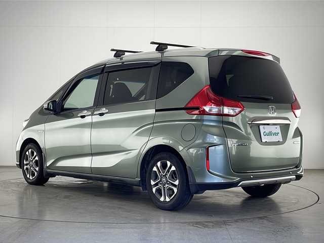 ホンダ フリード ハイブリット クロスター ホンダセンシング 宮崎県 2020(令2)年 7.8万km シルバーミストグリーンM ワンオーナー/寒冷地仕様/Honda SENSING/〇衝突軽減ブレーキ（CMBS）/〇誤発進抑制機能/〇路外逸脱警報機能/〇車線維持支援システム（LKAS）/〇アダプティブクルーズコントロール(ACC)/〇標識認識機能/〇先行車発進お知らせ機能/純正7インチSDナビ/フルセグTV/CD/DVD/Bluetooth/バックカメラ/両側パワースライドドア/合皮シート/シートヒーター/ビルトインETC/前後ドライブレコーダー/純正15インチAW