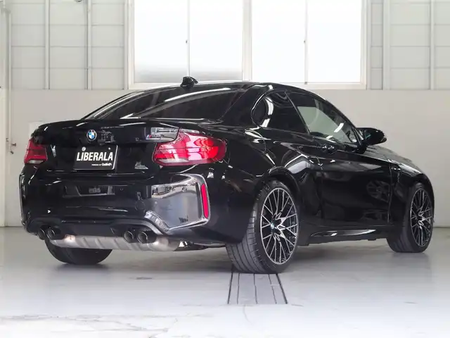 ＢＭＷ Ｍ２ コンペティション 兵庫県 2019(令1)年 1.8万km サファイアブラックP harman/kardon HiFiサウンド・システム/（360W、12スピーカー、7チャンネル・サラウンド）/純正ナビ/バックカメラ/ETC/黒革シート/パワーシート/シートヒーター/純正19インチAW/ドライビングアシスト/衝突軽減/LDW/アダプティブLEDヘッドライト/（LEDハイ／ロービーム、LEDスモール・ライト・リング。光軸自動調整機構付）/コンフォートアクセス/ドライブレコーダー