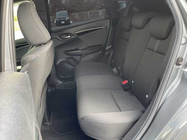 ホンダ フィット ハイブリット S ホンダセンシング 愛媛県 2018(平30)年 7.4万km シャイニンググレーM 純正ナビ/バックカメラ/衝突軽減システム/ビルトインETC/ドライブレコーダー前後/フルセグTV/クルーズコントロール追従あり/オートLED/レーンキープアシスト/横滑り防止装置/純正16AW/純正フロアマット/スペアキー1本/Bluetooth