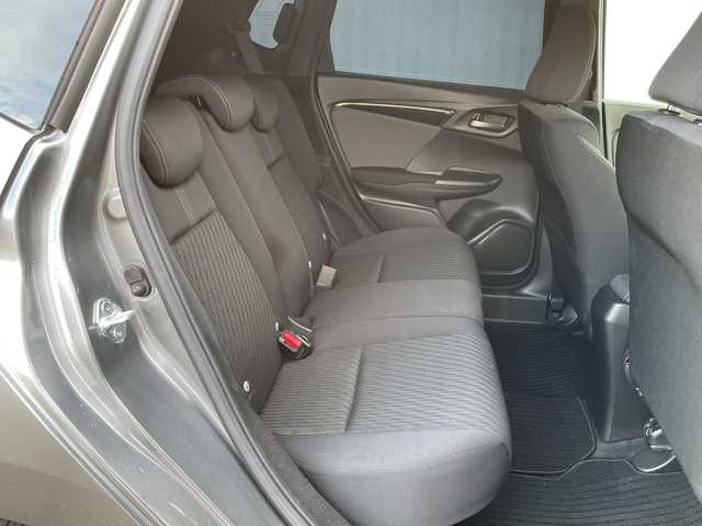 ホンダ フィット ハイブリット S ホンダセンシング 愛媛県 2018(平30)年 7.4万km シャイニンググレーM 純正ナビ/バックカメラ/衝突軽減システム/ビルトインETC/ドライブレコーダー前後/フルセグTV/クルーズコントロール追従あり/オートLED/レーンキープアシスト/横滑り防止装置/純正16AW/純正フロアマット/スペアキー1本/Bluetooth