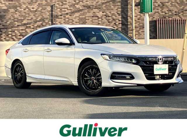 ホンダ アコード EX 静岡県 2021(令3)年 2.6万km プラチナホワイトパール エンジンスタートボタン/パワーステアリング/パワーウィンドウ/パドルシフト/アイドリングストップ/スマートキー/オートエアコン/レーダークルーズコントロール/USB入力端子/純正ETC/バックカメラ/純正8インチナビ（BT/フルセグ）/サンルーフ/純正フロアマット/純正アルミホイール車載/社外アルミホイール/D席N席パワーシート/レザーシート/全席シートヒーター/ABS/横滑り防止装置/レーンキープアシスト/オートライト/オートマチックハイビーム/LEDヘッドライト/W+サイドエアバッグ/衝突軽減システム/カーテンエアバッグ/BSM/ワイヤレス充電/ホンダセンシング