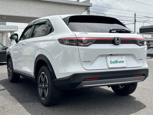ホンダ ヴェゼル ハイブリッド e:HEV X 広島県 2023(令5)年 1.4万km プラチナホワイトパール ディスプレイオーディオ/（AM/FM/BT/USB）/バックカメラ/レーダークルーズコントロール/レーンキープアシスト/前後コーナーセンサー/衝突被害軽減システム/純正AW16インチ/電子パーキングシステム/前後ドラレコ/LEDライト/LEDフォグ/オートライト/Honda CONNECT for Gathers/ナビ装着用スペシャルパッケージ