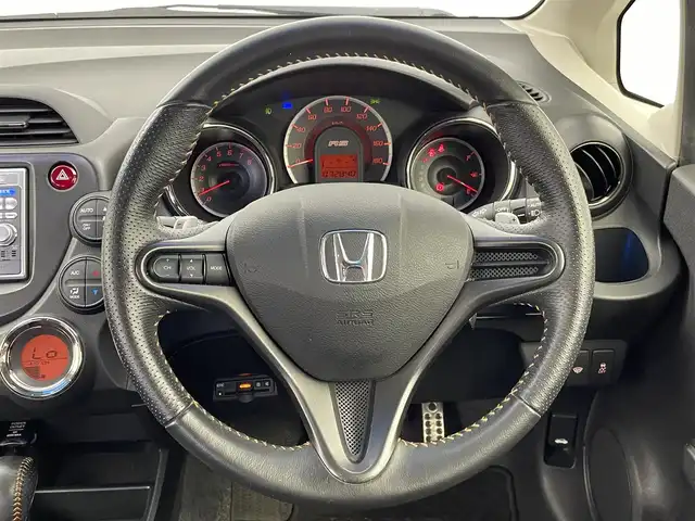 ホンダ フィット RS 群馬県 2013(平25)年 7.3万km ポリッシュドメタルメタリック 純正HDDナビ　バックカメラ　寒冷地仕様　ＨＩＤライト　オートライト　純正１６インチＡＷ　ステアリングリモコン　パドルシフト　横滑り防止装置　スマートキー　ＥＴＣ　ドライブレコーダー　禁煙車