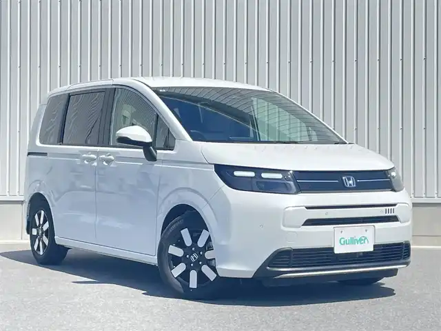 ホンダ フリード ハイブリット e:HEV AIR EX 群馬県 2025(令7)年 0.1万km パール ワンオーナー/ホンダセンシング/・衝突軽減ブレーキ/・踏み間違い衝突軽減システム/・急アクセル抑制機能/・路外逸脱抑制機能/・歩行者事故低減ステアリング/・先行車発進お知らせ機能/・標識認識機能/・ブラインドスポットインフォメーション/・オートハイビーム/・アダプティブドライビングビーム/・パーキングセンサーシステム/ホンダディスプレイオーディオ/（BT/USB/HDMI/AppleCarPlay/AndoroidAuto）/バックカメラ/ETC/ハーフレザー/シートヒーター（D席/N席）/両側パワースライドドア/ドライブレコーダー/3列シート/LEDヘッドライト/保証書/取扱説明書/スペアキー