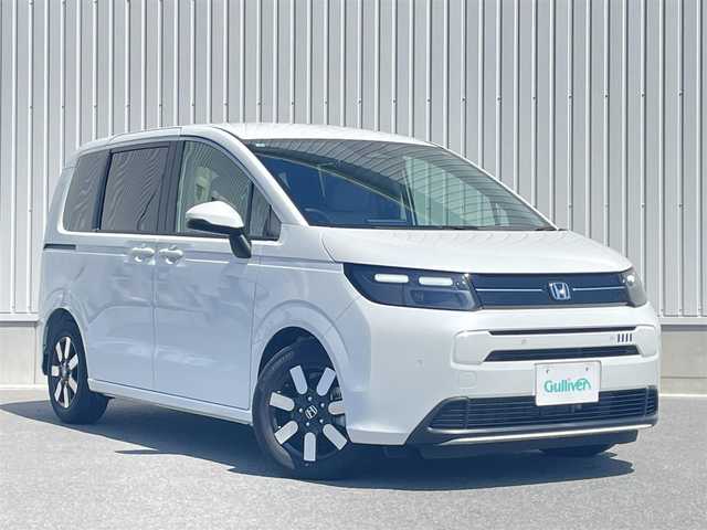 ホンダ フリード ハイブリット e:HEV AIR EX 東京都 2025(令7)年 0.1万km パール ワンオーナー/ホンダセンシング/・衝突軽減ブレーキ/・踏み間違い衝突軽減システム/・急アクセル抑制機能/・路外逸脱抑制機能/・歩行者事故低減ステアリング/・先行車発進お知らせ機能/・標識認識機能/・ブラインドスポットインフォメーション/・オートハイビーム/・アダプティブドライビングビーム/・パーキングセンサーシステム/ホンダディスプレイオーディオ/（BT/USB/HDMI/AppleCarPlay/AndoroidAuto）/バックカメラ/ETC/ハーフレザー/シートヒーター（D席/N席）/両側パワースライドドア/ドライブレコーダー/3列シート/LEDヘッドライト/保証書/取扱説明書/スペアキー