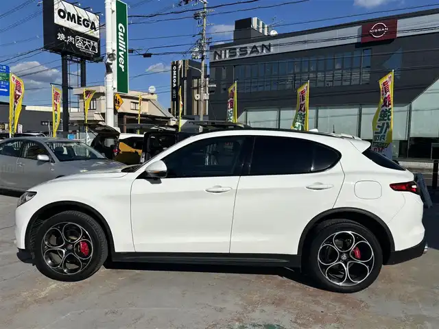 アルファロメオ ステルヴィオ 2.2ターボ ディーゼルQ4 スポーツPKG 京都府 2020(令2)年 3.4万km 白 ワンオーナー/33321キロ/ドライブレコーダー前後/ETC/メモリーナビ/バックカメラ/フルセグTV/ハーマンカードン/レーダークルーズ/メモリーシート123/シートヒーター/ステアリングヒーター/LEDヘットライト/USB/コーナーセンサー/保証書/説明書