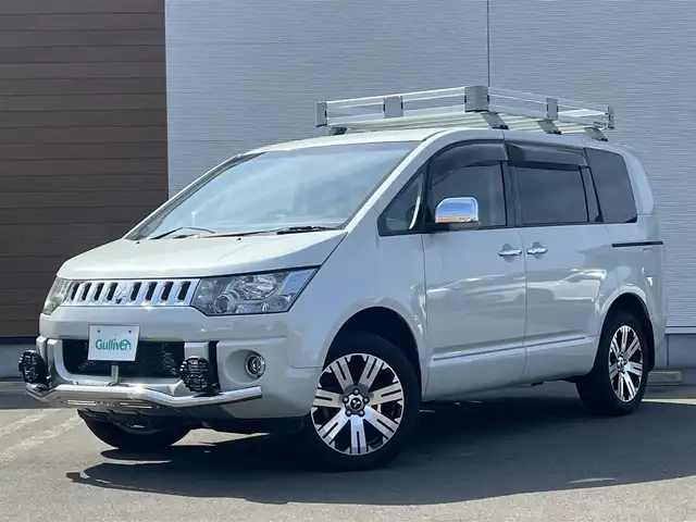 三菱 デリカＤ：５ D－Premium 秋田県 2015(平27)年 7.4万km ウォームホワイトパール 純正ナビ/４WD/両側パワスラ/純正アルミ/D席パワーシート/フルセグ/バックカメラ/スマートキー/前席シートヒーター/クルーズコントロール/フリップダウンモニター/パドルシフト/ルーフラック/スキッドバー/ETC/電動リアゲート/ステアリングスイッチ/社外フロアマット/純正ドアバイザー/オートライト/ダブルオートエアコン/パワーステアリング/パワーウィンドウ/電動格納ミラー/保証書/取扱説明書/記録簿