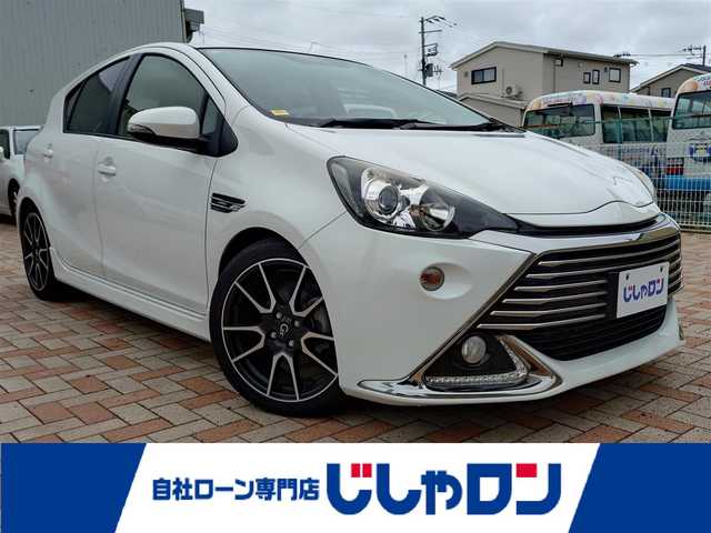 トヨタ アクア G G’s 東京都 2014(平26)年 8.2万km ライムホワイトパールクリスタルシャイン (株)IDOMが運営する【じしゃロン新潟店】の自社ローン専用車両になります。/こちらは現金またはオートローンご利用時の価格です。自社ローンご希望の方は別途その旨お申付け下さい/純正SDナビ/FM/AM/CD/視聴可能/ワンセグTV視聴可能(走行中視聴可能)/Bluetooth/USB接続可能/バックカメラ/ETC/プッシュスタート/ハーフレザーシート/前方のみドライブレコーダー(品番：DRY-FH51)/純正フロアマット/電動格納ウィンカーミラー/フォグランプ/ECO/EVモード/スマートキー/スペアキー×１/取扱説明書
