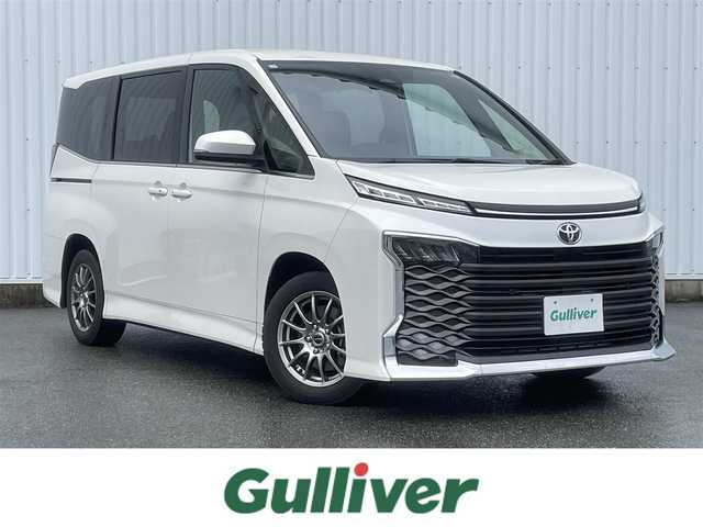 トヨタ ヴォクシー S－Z 福岡県 2023(令5)年 0.8万km ホワイトパールクリスタルシャイン トヨタセーフティセンス/PCS/LDA/クリアランスソナー/純正１０．５インチＤＡナビ/フルセグTV/CD/DVD/BT/HDMI/バックカメラ/両側パワースライドドア/シートヒーター/ハーフレザー/レーダークルーズコントロール/社外ＡＷ/ビルトインETC2.0/電動パーキング/ブレーキホールド/スマートキー/プッシュスタート/LEDオートライト
