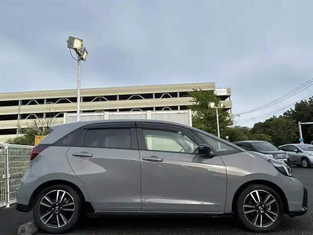 ホンダ フィット e:HEV RS 愛知県 2023(令5)年 3万km グレー 純正ナビ/　【BT/地デジTV/USB】/ホンダセンシング/・衝突軽減ブレーキ/・先行車発信お知らせ/・歩行者事故低減ステアリング/・路外逸脱抑制機能/・標識認識/・アダプティブクルーズコントロール/・車線維持支援/純正LEDヘッドライト/純正16インチAW/バックカメラ/ビルトインETC/パドルシフト/バックカメラ/ビルトインETC2.0/ドライブモードセレクター/電動パーキングブレーキ