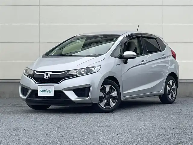 ホンダ フィット ハイブリット Fパッケージ 茨城県 2016(平28)年 6.7万km アラバスターシルバーメタリック プッシュスタート/スマートキ-/スペアキー/ステアリングスイッチ/横滑り防止装置/ＡＢＳ/純正フロアマット/ETC/オートライト/パワステ/LEDヘッドライト/ダブルエアバック/ワンセグ視聴可