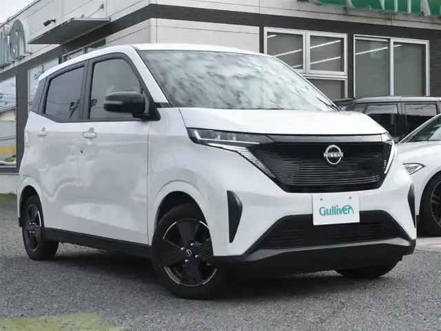 日産 サクラ X 神奈川県 2023(令5)年 0.7万km ホワイトパール ディスプレイオーディオ/：Bluetoothオーディオ/ビルトインETC/360度セーフティアシスト/：e-pedal/純正１４インチアルミホイール/純正フロアマット/クリアランスソナー