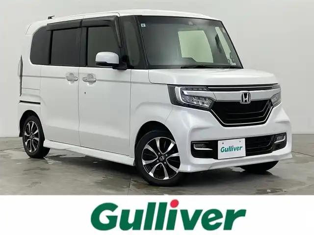 ホンダ Ｎ ＢＯＸ カスタム G L ホンダセンシング 富山県 2019(令1)年 6.5万km プラチナホワイトパール ワンオーナー/純正8型ナビ（AM/FM/CD/DVD/USB/BT）/フルセグTV/バックカメラ/両側パワースライドドア/衝突被害軽減ブレーキ/アダプティブクルーズコントロール/レーンキープアシスト/オートマチックハイビーム/LEDヘッドライト/コーナーセンサー/ドライブレコーダー/ビルトインETC/スマートキー×２/プッシュスタート/社外アフロアマット/シートカバー/ステアリングカバー/アイドリングストップ/取扱説明書/保証書