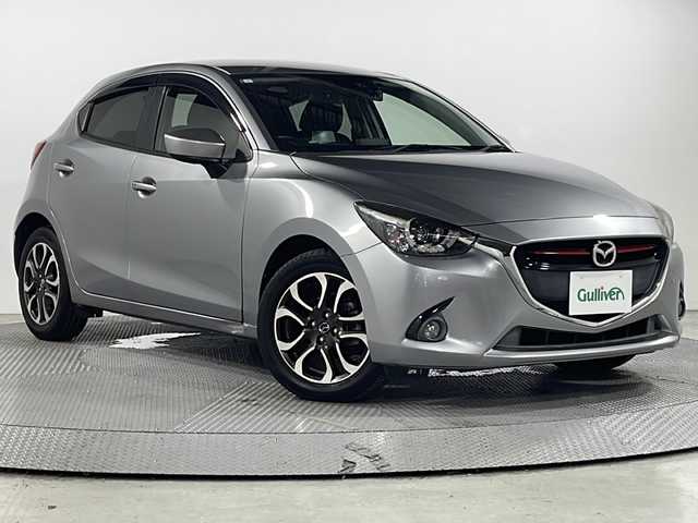マツダ デミオ XD ツーリング 広島県 2015(平27)年 6.6万km アルミニウムメタリック 禁煙車/マツダコネクトナビ/クルーズコントロール/パドルシフト/ヘッドアップディスプレイ/衝突軽減ブレーキ/LEDヘッドライト/オートライト/純正１６インチアルミホイール/ドライブレコーダー/スマートキー/ETC