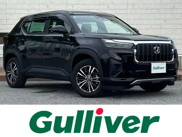 ホンダ ＷＲ－Ｖ X 滋賀県 2024(令6)年 0.6万km クリスタルブラックパール 純正フロントグリル/スタッドレスタイヤ積込（純正ホイールキャップ付）/8インチディスプレイオーディオ/バックカメラ/ETC/ドライブレコーダー/ホンダセンシング/・踏み間違い防止アシスト/・プリクラッシュブレーキアシスト/・ヒルスタート（坂道発進）アシスト/・TCS（トラクションコントロールシステム）/・VDC（ビークルダイナミクスコントロール）/・レーンキープアシスト/・車間自動制御システム/・ASCD（オートスピードコントロール装置）/・ABS（アンチロックブレーキシステム）/・コーナー・バックセンサー（ソナー）/・標識検知機能/・盗難防止アラーム/電動格納ミラー/オートライト/LEDヘッドライト/ヘッドライトレベライザー/オートエアコン/スマートキー/スペアキー/プッシュスタート/スマホホルダー/純正ゴムマット/ドアバイザー