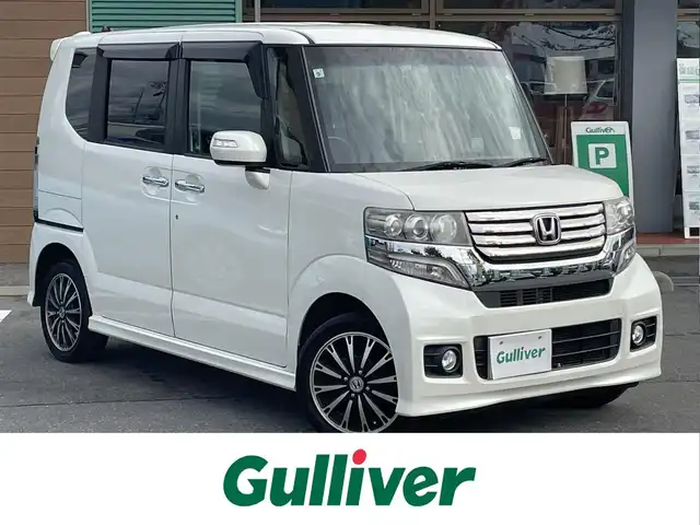 ホンダ Ｎ ＢＯＸ カスタム G ターボパッケージ 道東・釧路十勝 2013(平25)年 9.2万km プレミアムホワイトパール ワンオーナー/4WD/純正ナビ/・Bluetooth/TV/CD/DVD/バックカメラ/社外ETC/純正フロアマット/クルーズコントロール追走無し/両側パワースライド/純正15インチAW/オートライト/パドルシフト/エンジンスターター/スペアキー/スマートキー/取り扱い説明書/保証書