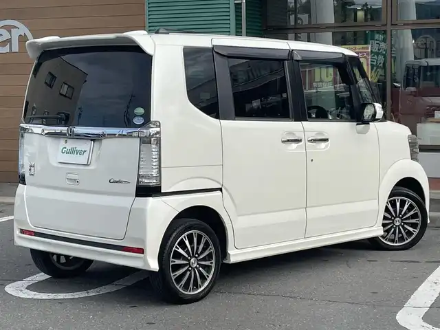 ホンダ Ｎ ＢＯＸ カスタム G ターボパッケージ 道東・釧路十勝 2013(平25)年 9.2万km プレミアムホワイトパール ワンオーナー/4WD/純正ナビ/・Bluetooth/TV/CD/DVD/バックカメラ/社外ETC/純正フロアマット/クルーズコントロール追走無し/両側パワースライド/純正15インチAW/オートライト/パドルシフト/エンジンスターター/スペアキー/スマートキー/取り扱い説明書/保証書