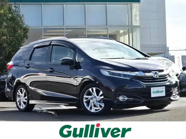 ホンダ シャトル ハイブリッド Z 鹿児島県 2015(平27)年 2.7万km ミッドナイトブルービームM 〇ストラーダナビ/〇フルセグTV/〇バックカメラ/〇ETC/〇クルーズコントロール/〇シティブレーキアクティブシステム/〇SRSエアバッグ/〇オートライト/〇LEDヘッドランプ/〇プラズマクラスター付オートエアコン/〇革巻きステアリングホイール/〇ステアリングスイッチ/〇パドルシフト/〇合皮/ファブリックコンビシート/〇シートヒーター/〇純正16インチアルミホイール/〇シルバールーフレール/〇スマートエントリー/スタートシステム/〇禁煙車