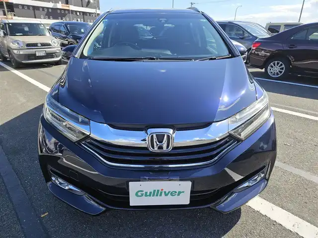 ホンダ シャトル ハイブリッド Z 鹿児島県 2015(平27)年 2.7万km ミッドナイトブルービームM 〇ストラーダナビ/〇フルセグTV/〇バックカメラ/〇ETC/〇クルーズコントロール/〇シティブレーキアクティブシステム/〇SRSエアバッグ/〇オートライト/〇LEDヘッドランプ/〇プラズマクラスター付オートエアコン/〇革巻きステアリングホイール/〇ステアリングスイッチ/〇パドルシフト/〇合皮/ファブリックコンビシート/〇シートヒーター/〇純正16インチアルミホイール/〇シルバールーフレール/〇スマートエントリー/スタートシステム/〇禁煙車