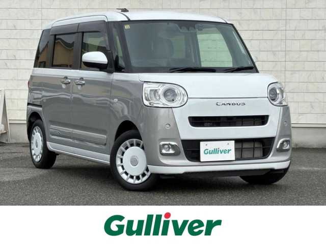 ダイハツ ムーヴ キャンバス ストライプス G 山口県 2023(令5)年 2.1万km シャイニングホワイトパール/スムーズグレーマイカメタリック 純正ナビ/9インチスマホ連携デイスプレイオーディオ/BT/HDMI/フルセグTV/両側パワースライド/前方ドライブレコーダー/衝突軽減ブレーキ/コーナーセンサー/フォグランプ/オートライト/オートホールド/保温機能付きカップホルダー/電動格納ミラー/純正フロアマット