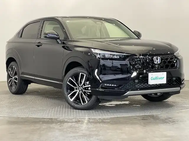 ホンダ ヴェゼル ハイブリッド e:HEV Z 栃木県 2025(令7)年 0.1千km クリスタルブラックパール 純正9インチホンダコネクトディスプレイナビ/(フルセグTV・Bluetooth)/バックカメラ/フロントグリル(メーカーオプション)　ベルリナブラック/ホンダセンシング/ ・衝突軽減システム/ ・車線維持システム/ ・アダプティブクルーズコントロール/ ・オートハイビーム/ ・アダプティブクルーズコントロール/前後コーナーセンサー/置くだけ充電/純正ビルトインETC2.0/ハーフレザーシート/シートヒーター/パワーバックドア/純正アルミホイール/スマートキー/プッシュスタート