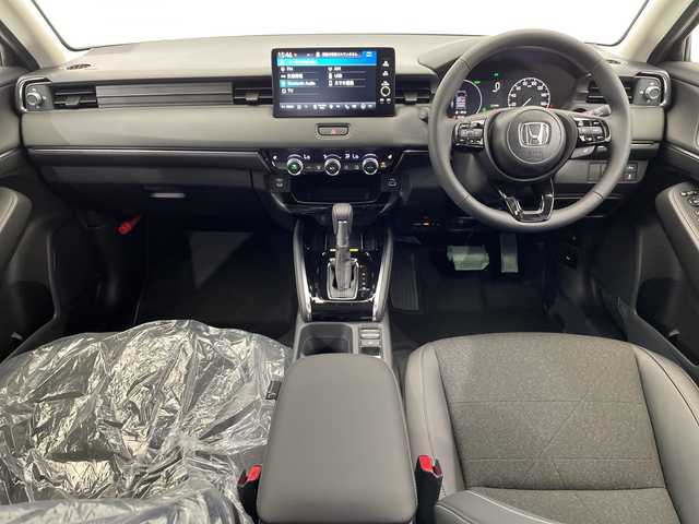 ホンダ ヴェゼル ハイブリッド e:HEV Z 栃木県 2025(令7)年 0.1千km クリスタルブラックパール 純正9インチホンダコネクトディスプレイナビ/(フルセグTV・Bluetooth)/バックカメラ/フロントグリル(メーカーオプション)　ベルリナブラック/ホンダセンシング/ ・衝突軽減システム/ ・車線維持システム/ ・アダプティブクルーズコントロール/ ・オートハイビーム/ ・アダプティブクルーズコントロール/前後コーナーセンサー/置くだけ充電/純正ビルトインETC2.0/ハーフレザーシート/シートヒーター/パワーバックドア/純正アルミホイール/スマートキー/プッシュスタート