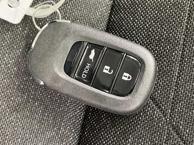 ホンダ ヴェゼル ハイブリッド e:HEV Z 栃木県 2025(令7)年 0.1千km クリスタルブラックパール 純正9インチホンダコネクトディスプレイナビ/(フルセグTV・Bluetooth)/バックカメラ/フロントグリル(メーカーオプション)　ベルリナブラック/ホンダセンシング/ ・衝突軽減システム/ ・車線維持システム/ ・アダプティブクルーズコントロール/ ・オートハイビーム/ ・アダプティブクルーズコントロール/前後コーナーセンサー/置くだけ充電/純正ビルトインETC2.0/ハーフレザーシート/シートヒーター/パワーバックドア/純正アルミホイール/スマートキー/プッシュスタート