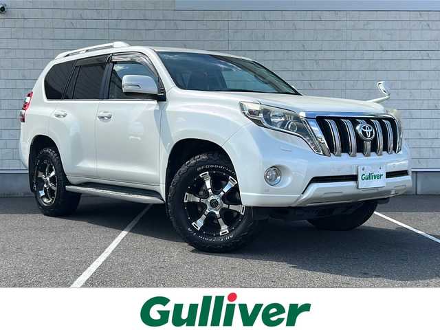 トヨタ ランドクルーザー プラド TZ－G 栃木県 2015(平27)年 7.9万km ホワイトパールクリスタルシャイン ワンオーナー/純正SDナビ/・NSZT-W64/・Bluetooth CD DVD/・TV フルセグ/バックカメラ/電動ガラスサンルーフ/ALPINE 後部モニター　PKH-M900SV/ドアバイザー/クルーズコントロール/スペアスマートキー/パワーシート/レザーシート/シートヒーター/前後ドライブレコーダー/ETC/MYRTLE 18インチアルミホイール/コーナーセンサー/ダウンヒルアシストコントロール/LEDヘッドライト/オートライト/保証書/取扱説明書/記録簿