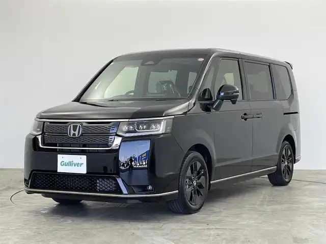 ホンダ ステップワゴン スパーダ eHEV 群馬県 2025(令7)年 0.1万km未満 クリスタルブラックパール 純正メモリーナビ　バックカメラ　両側パワースライドドア　レーダークルーズコントロール　パワーバックドア　ＢＳＭ　ＬＥＤ　ＡＨＢ　ハーフレザーシート　純正１６インチＡＷ　ステアリングリモコン　禁煙車