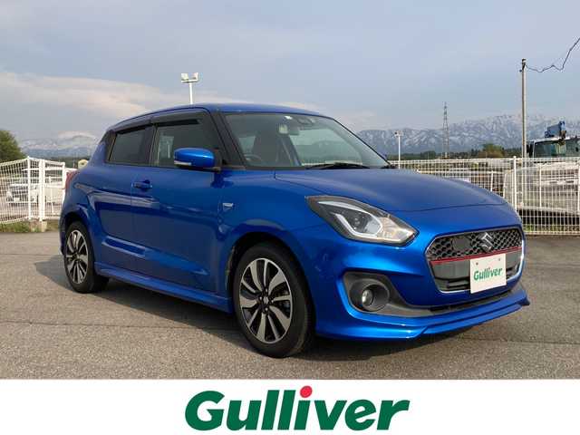 スズキ スイフト HYBRID RS 富山県 2018(平30)年 2.9万km スピーディーブルーM セーフティパッケージ/・デュアルセンサーブレーキサポート/・誤発進抑制機能/・車線逸脱警報機能/・先行車発進お知らせ機能/・アダプティブクルーズコントロール/・ふらつき警報機能/・ハイビームアシスト機能/純正SDナビ　CN-RZ83/（CD/DVD/USB/SD/BT/フルセグTV)/ステアリングリモコン/バックカメラ/パドルシフト/運転席シートヒーター/プッシュスタート・スマートキー/ETC/LEDヘッドライト/純正フロアマット・バイザー/スペアキー/保証書・取扱説明書