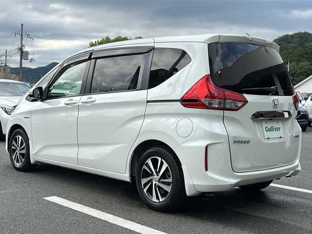 ホンダ フリード ハイブリット EX 京都府 2016(平28)年 6.8万km ホワイトオーキッドパール メーカーオプションインターナビ　フルセグＴＶ　バックカメラ　シートヒーター　両側パワースライドドア　ホンダセンシング　アダプティブクルーズコントロール　ドライブレコーダー　LEDヘッドライト　ETC