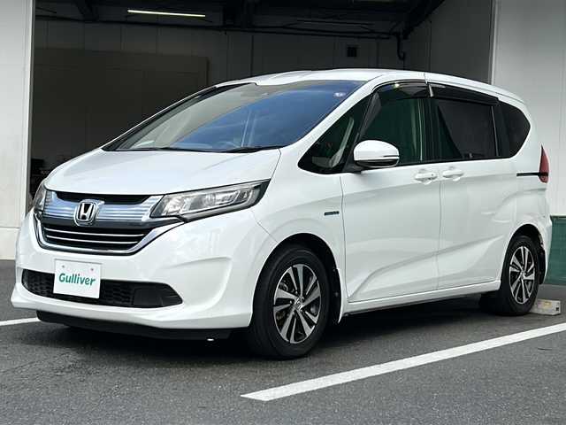 ホンダ フリード ハイブリット EX 京都府 2016(平28)年 6.8万km ホワイトオーキッドパール メーカーオプションインターナビ　フルセグＴＶ　バックカメラ　シートヒーター　両側パワースライドドア　ホンダセンシング　アダプティブクルーズコントロール　ドライブレコーダー　LEDヘッドライト　ETC