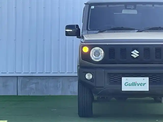 スズキ ジムニー XC 香川県 2019(平31)年 3.9万km ミディアムグレー 社外ＳＤナビ/→フルセグＴＶ/バックカメラ/Bluetooth/CD/社外ショックアムソーバー/社外リアラダー/クルーズコントロール/レーンキープアシスト/衝突軽減システム/横滑り防止機能/ダウンヒルアシストコントロール/アイドリングストップ/パワーステアリング/パワーウィンドウ/エアバック→Ｗ＋サイド/カーテンエアバック/オートエアコン/ETC/シートヒーター/純正ＬＥＤライト/純正アルミホイール/純正フロアマット　/社外ミュージックサーバー（ＳＤなし）　/盗難防止車/プッシュスタート/スマートキー/オートマチックハイビーム/オートライト/アシストミラー/スペアキー1本/背面タイヤ