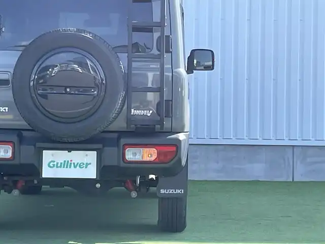 スズキ ジムニー XC 香川県 2019(平31)年 3.9万km ミディアムグレー 社外ＳＤナビ/→フルセグＴＶ/バックカメラ/Bluetooth/CD/社外ショックアムソーバー/社外リアラダー/クルーズコントロール/レーンキープアシスト/衝突軽減システム/横滑り防止機能/ダウンヒルアシストコントロール/アイドリングストップ/パワーステアリング/パワーウィンドウ/エアバック→Ｗ＋サイド/カーテンエアバック/オートエアコン/ETC/シートヒーター/純正ＬＥＤライト/純正アルミホイール/純正フロアマット　/社外ミュージックサーバー（ＳＤなし）　/盗難防止車/プッシュスタート/スマートキー/オートマチックハイビーム/オートライト/アシストミラー/スペアキー1本/背面タイヤ