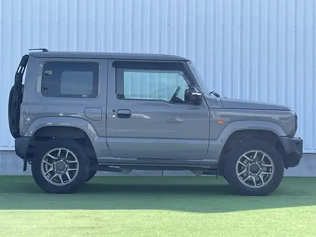 スズキ ジムニー XC 香川県 2019(平31)年 3.9万km ミディアムグレー 社外ＳＤナビ/→フルセグＴＶ/バックカメラ/Bluetooth/CD/社外ショックアムソーバー/社外リアラダー/クルーズコントロール/レーンキープアシスト/衝突軽減システム/横滑り防止機能/ダウンヒルアシストコントロール/アイドリングストップ/パワーステアリング/パワーウィンドウ/エアバック→Ｗ＋サイド/カーテンエアバック/オートエアコン/ETC/シートヒーター/純正ＬＥＤライト/純正アルミホイール/純正フロアマット　/社外ミュージックサーバー（ＳＤなし）　/盗難防止車/プッシュスタート/スマートキー/オートマチックハイビーム/オートライト/アシストミラー/スペアキー1本/背面タイヤ